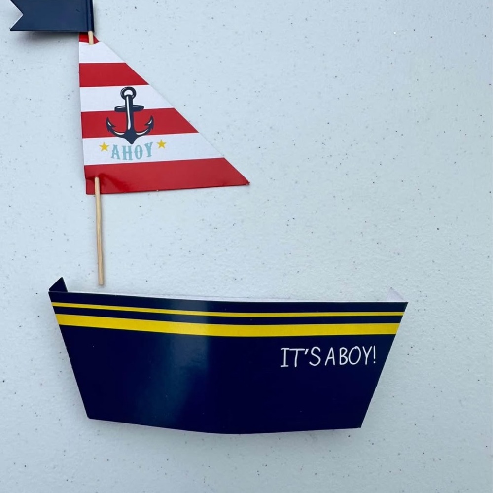 20 It’s A Boy sailboat cupcake holders and toppers